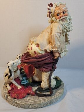 Santa W/ Dogs Pulling On His Drawers 10” resin figurine  Christmas (A4)
